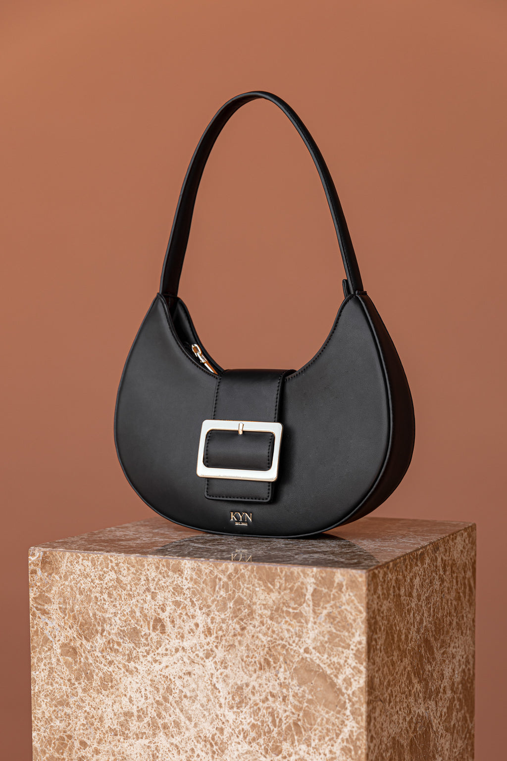 Kyn black womans vegan leather handbag