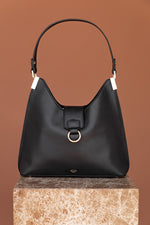 Load image into Gallery viewer, Black vegan handbag with gold ring detailing and hardware.
